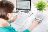 Woman working on a federal income tax return