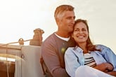 Older couple relaxing on a boat