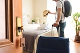 Man checking into hotel room or leaving hotel