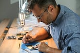 Older man making DIY smartphone repairs