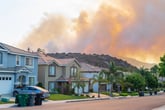 Wildfire near homes in Corona, California