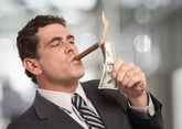 Rich guy lighting cigar with money.