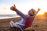 Senior retired man in a chair on the beach