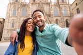 Tourists in Barcelona having fun during summer vacation and visiting Barcelona Cathedral historic landmark