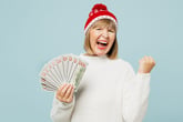 Happy senior woman holding money