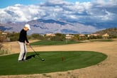 Senior woman playing golf in retirement at a golf course in Tucson, Arizona