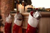 Christmas stockings hanging from a fireplace