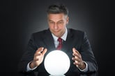 Businessman gazing into a crystal ball
