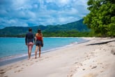 Couple walking on a beach in Costa Rica