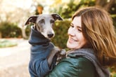Woman holding an Italian greyhound