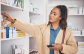 Woman shopping for over-the-counter medication