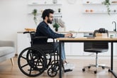 Man in wheelchair working remotely
