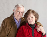 Serious senior couple