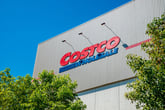Costco Wholesale store sign in front of trees