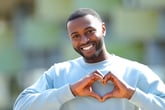 Man making the heart symbol with his hands