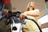Woman filling up gas tank