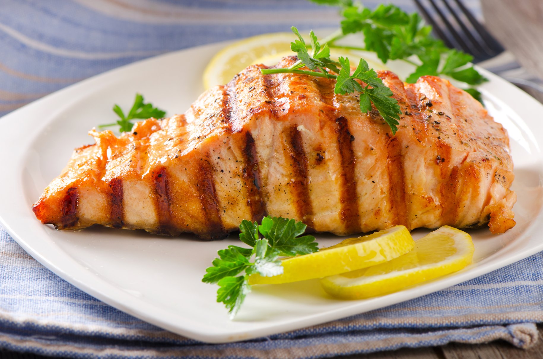 Grilled salmon on a dinner plate. 