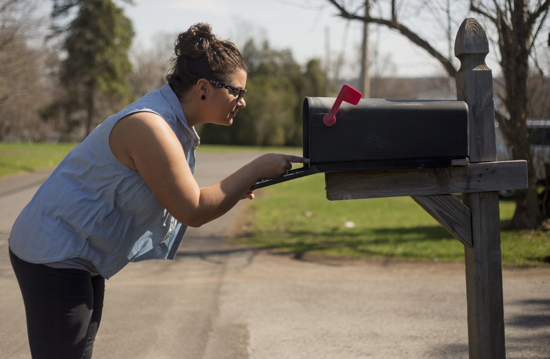 Woman checking her mailbox