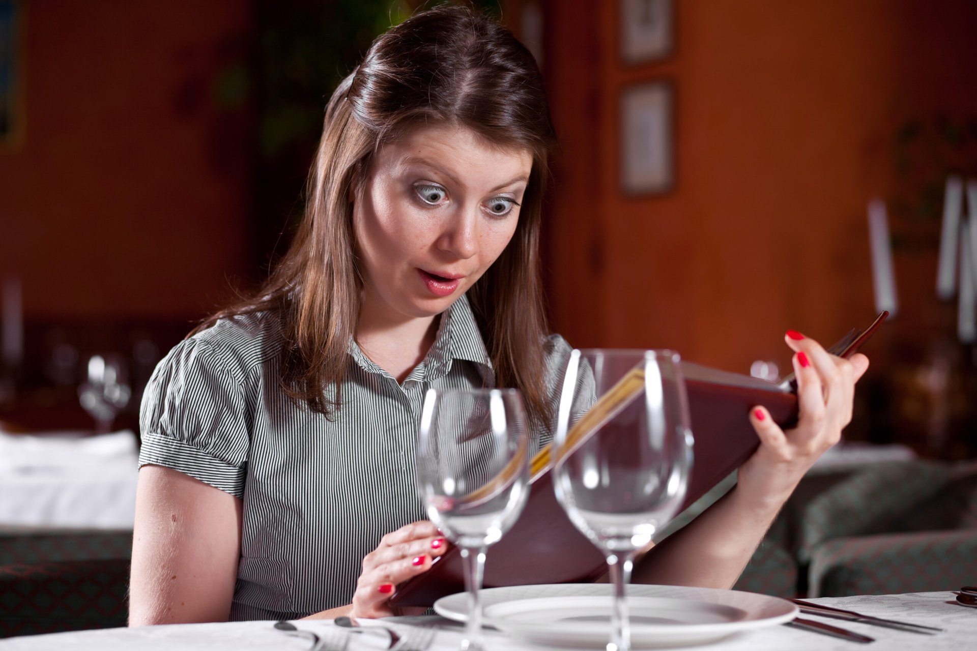 Woman looks at shockingly high wine prices