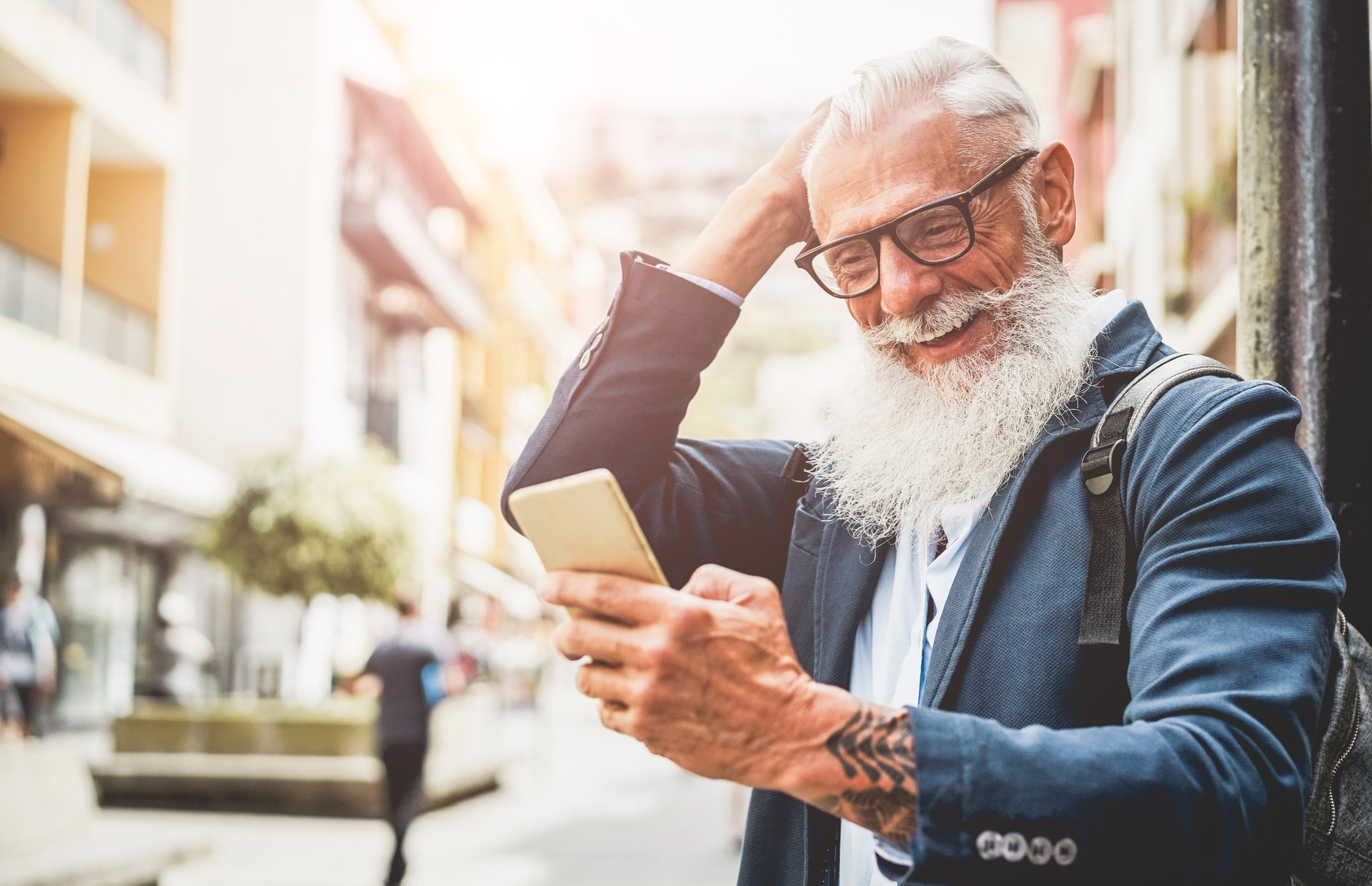 Older bearded man with cellphone