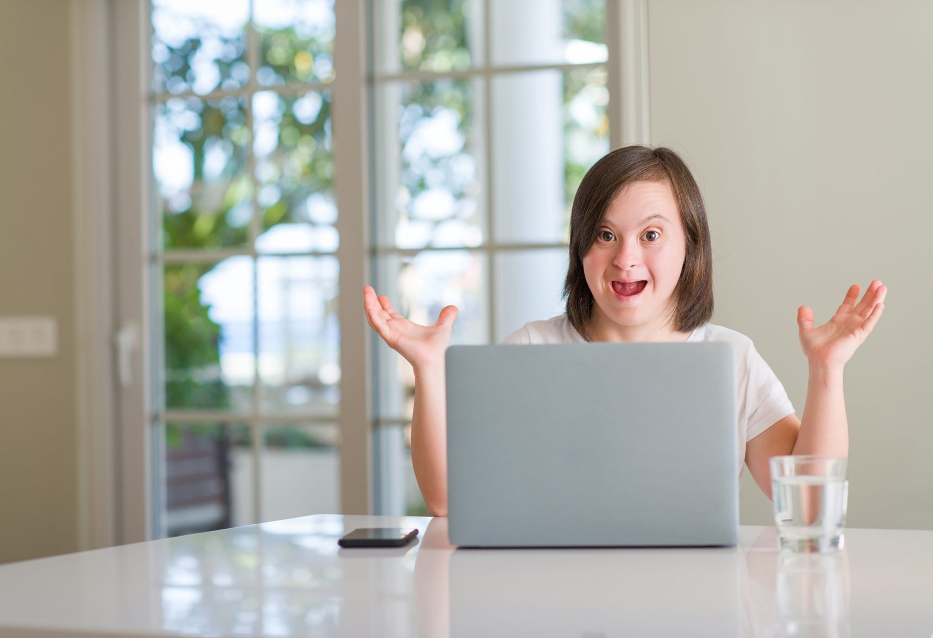 Excited woman on a laptop