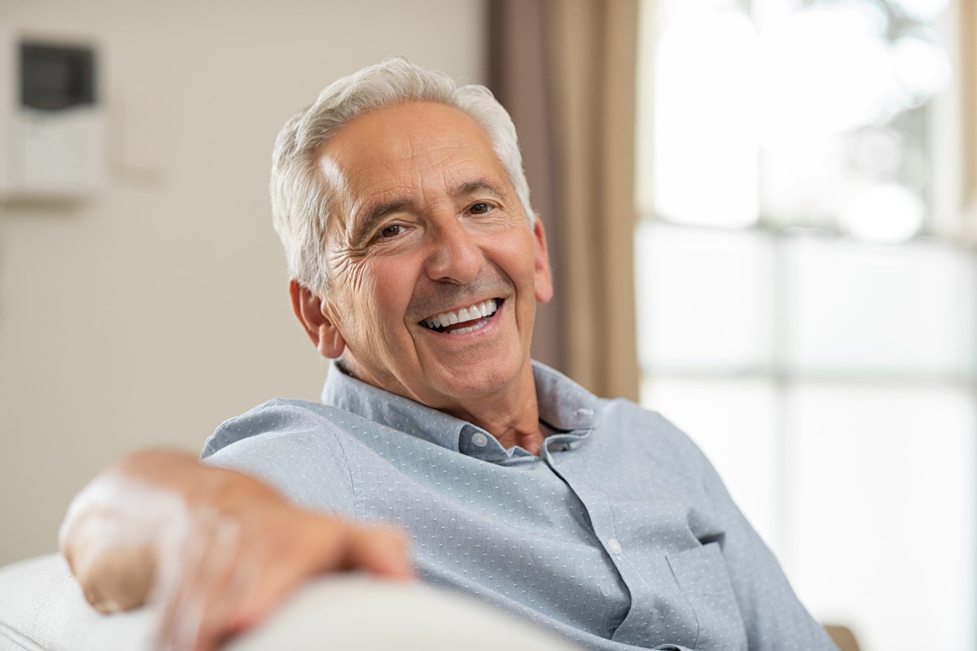 Man smiling on couch