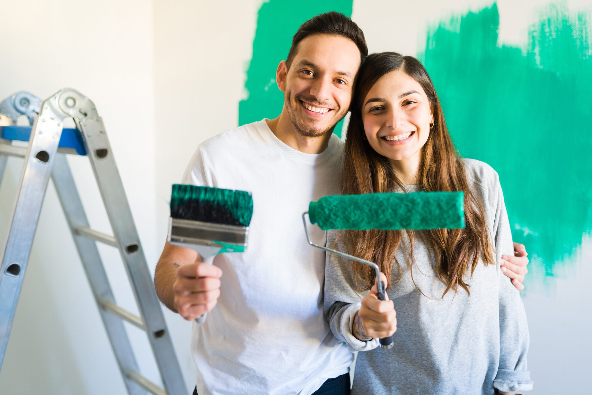 Couple painting their home