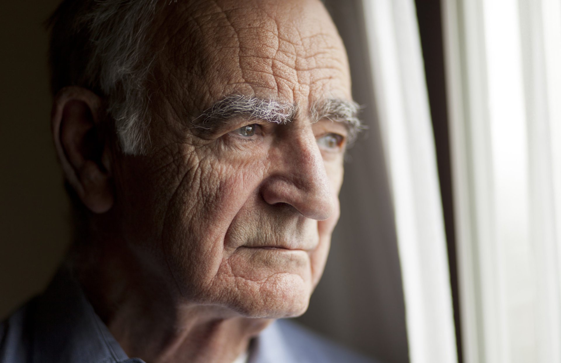 Elderly man lost in thought