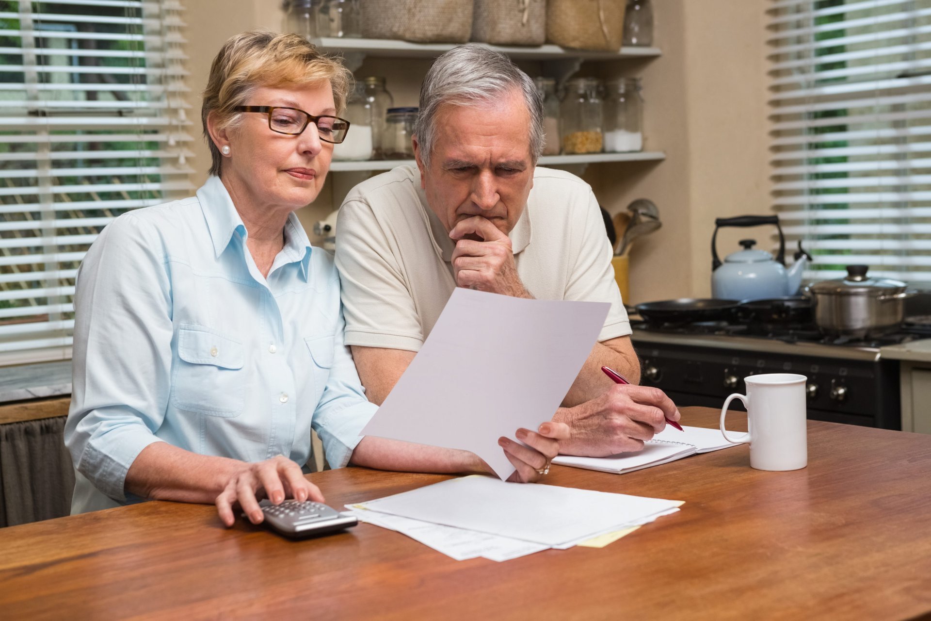 Senior couple doing retirement planning and math