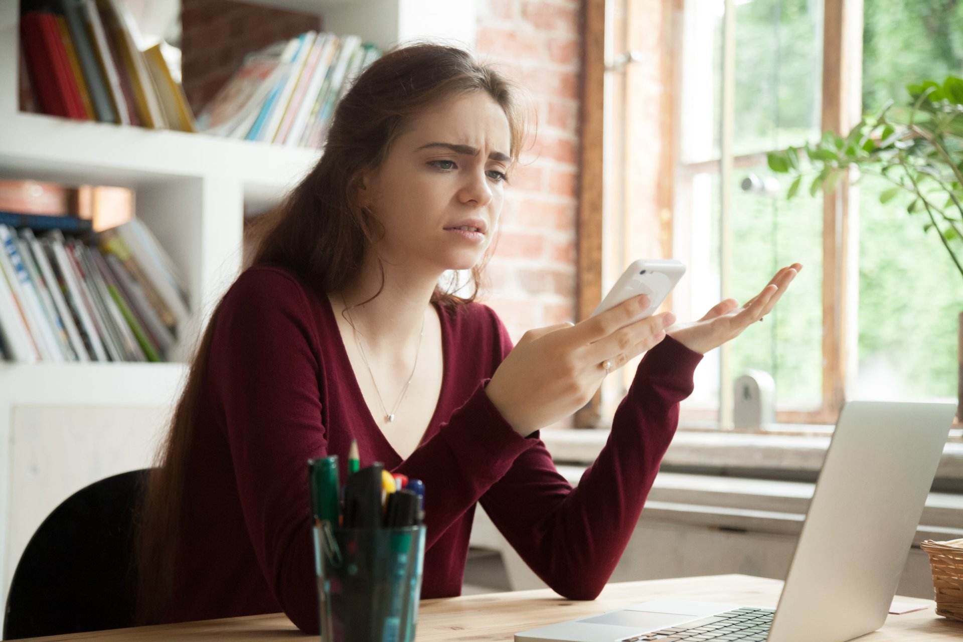 Woman frustrated with lack of cell phone coverage