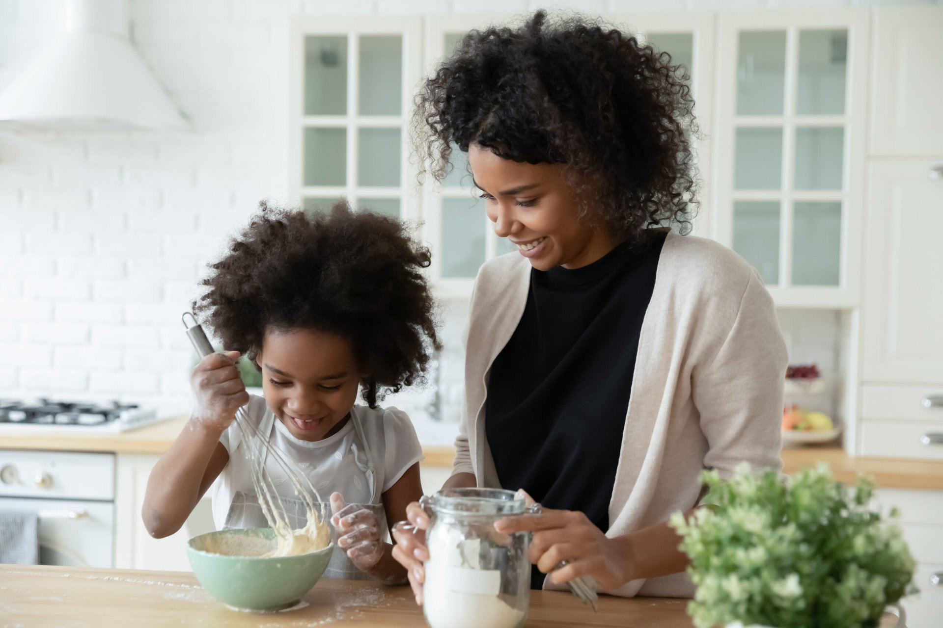 Mother and daughter with mixing bowl