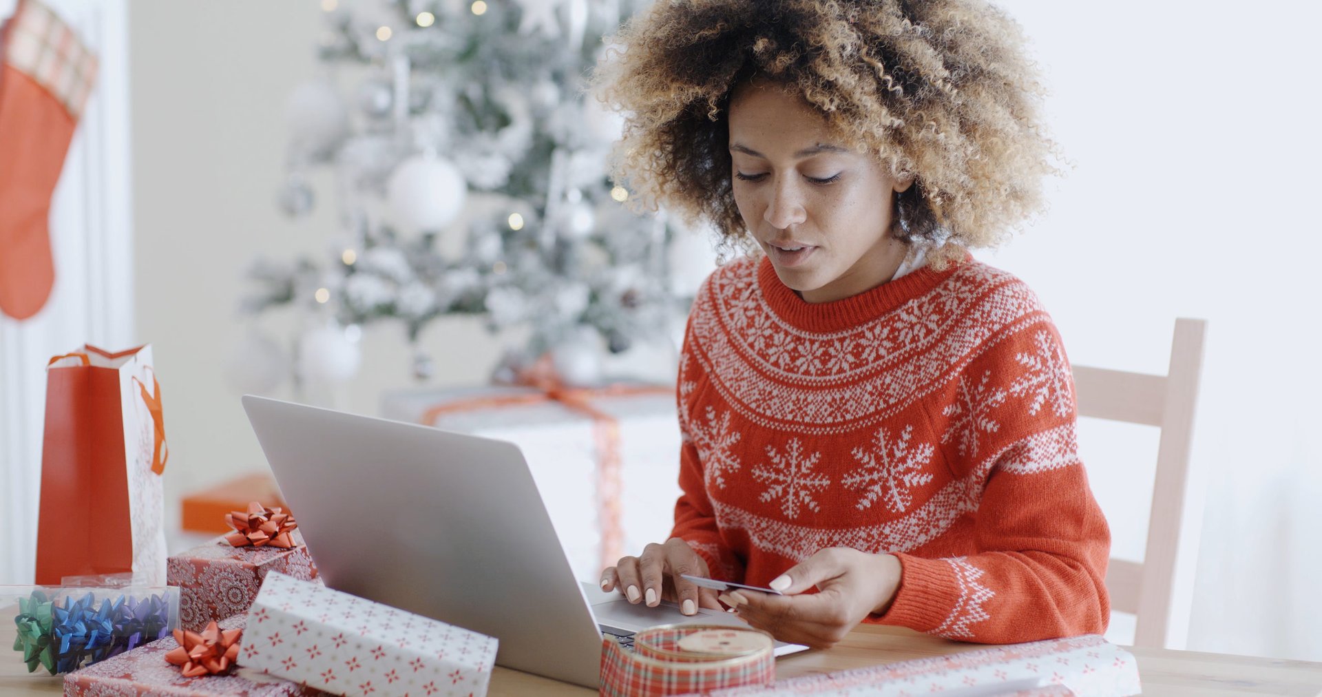 Woman shopping for holiday gifts online