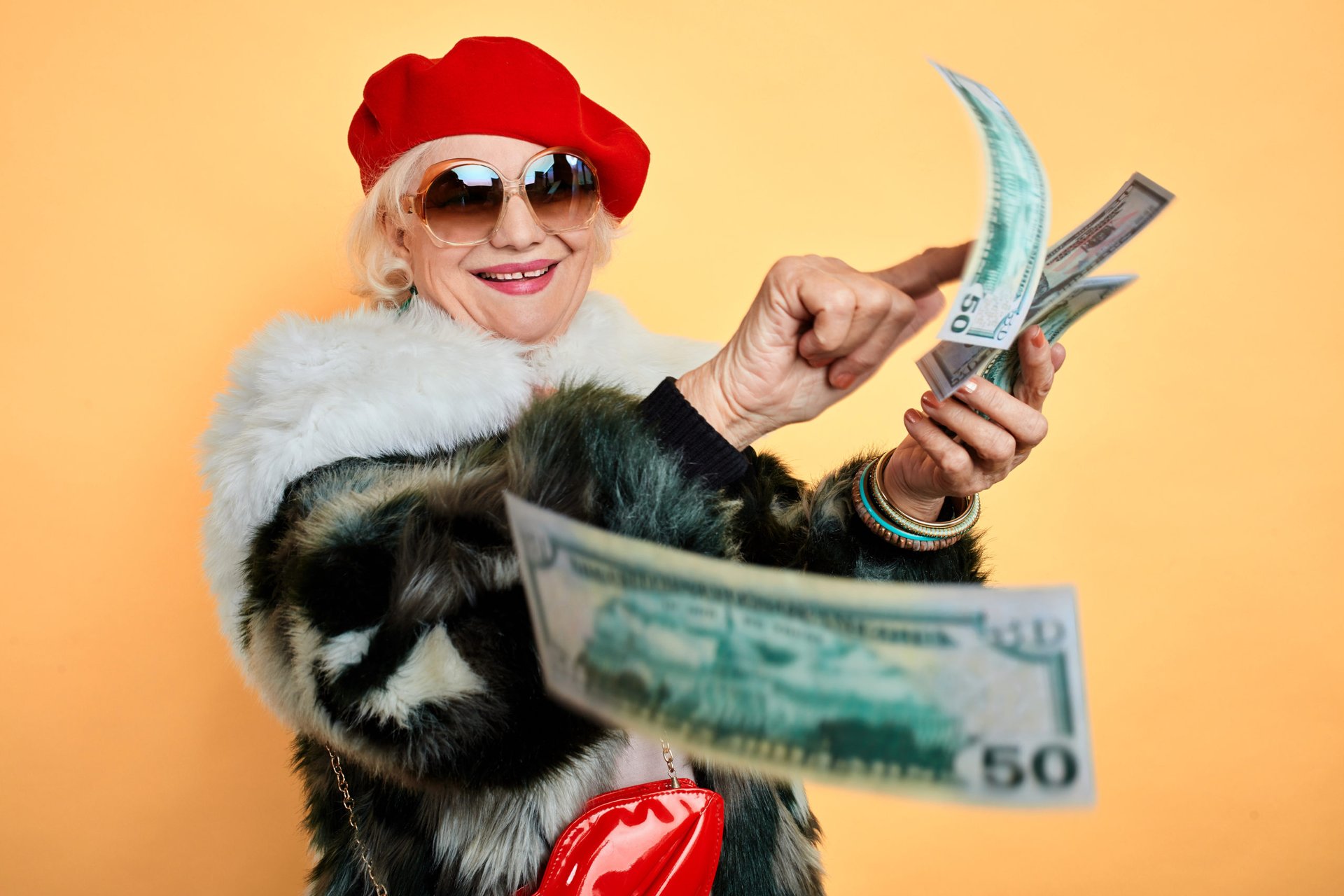 senior woman lots of money happy retirement