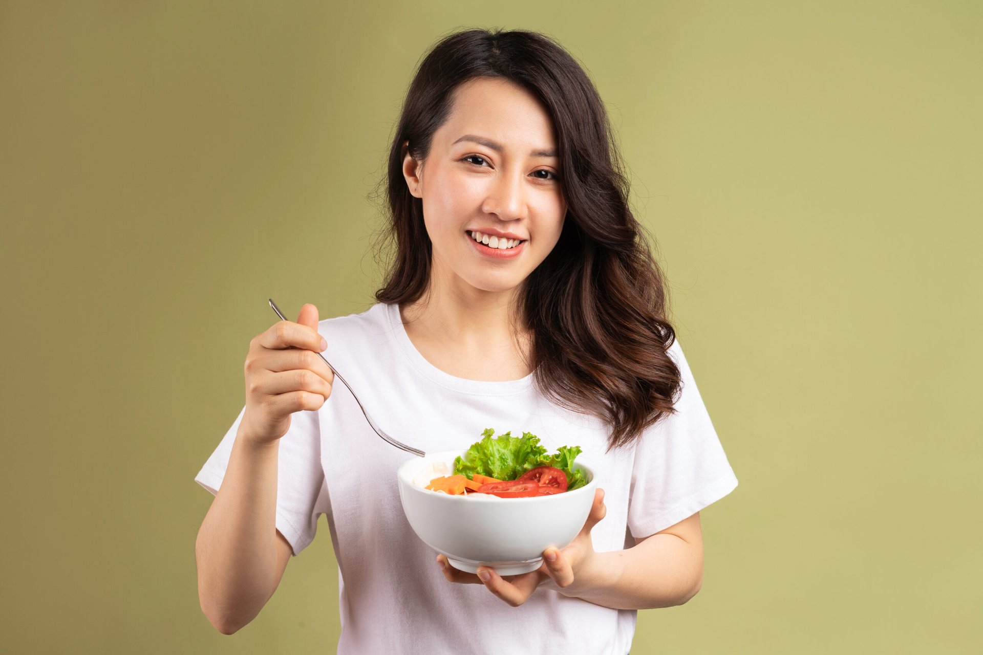 Woman eating healthful food