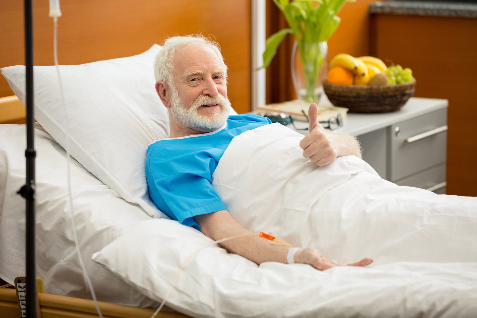 Senior patient in hospital bed.