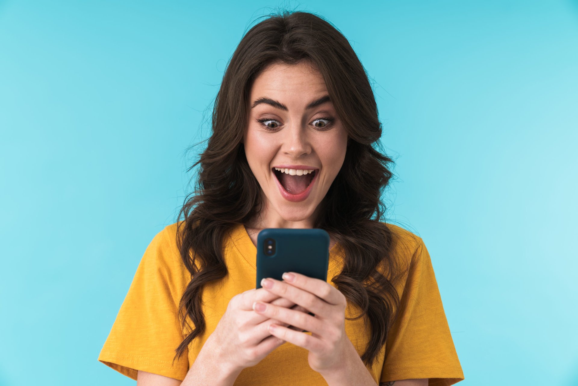 Woman excited by her low cell phone bill