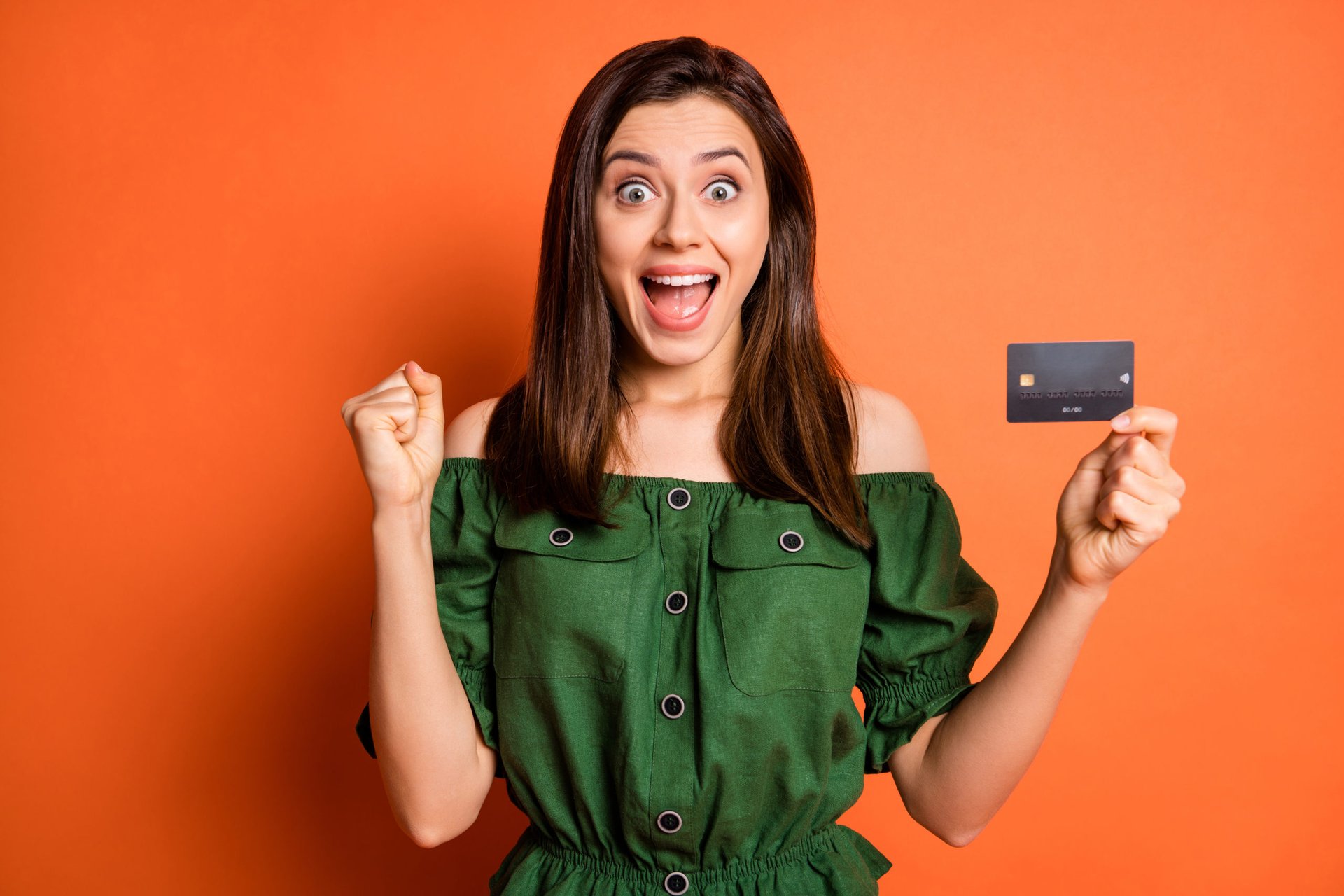 Excited woman with credit card