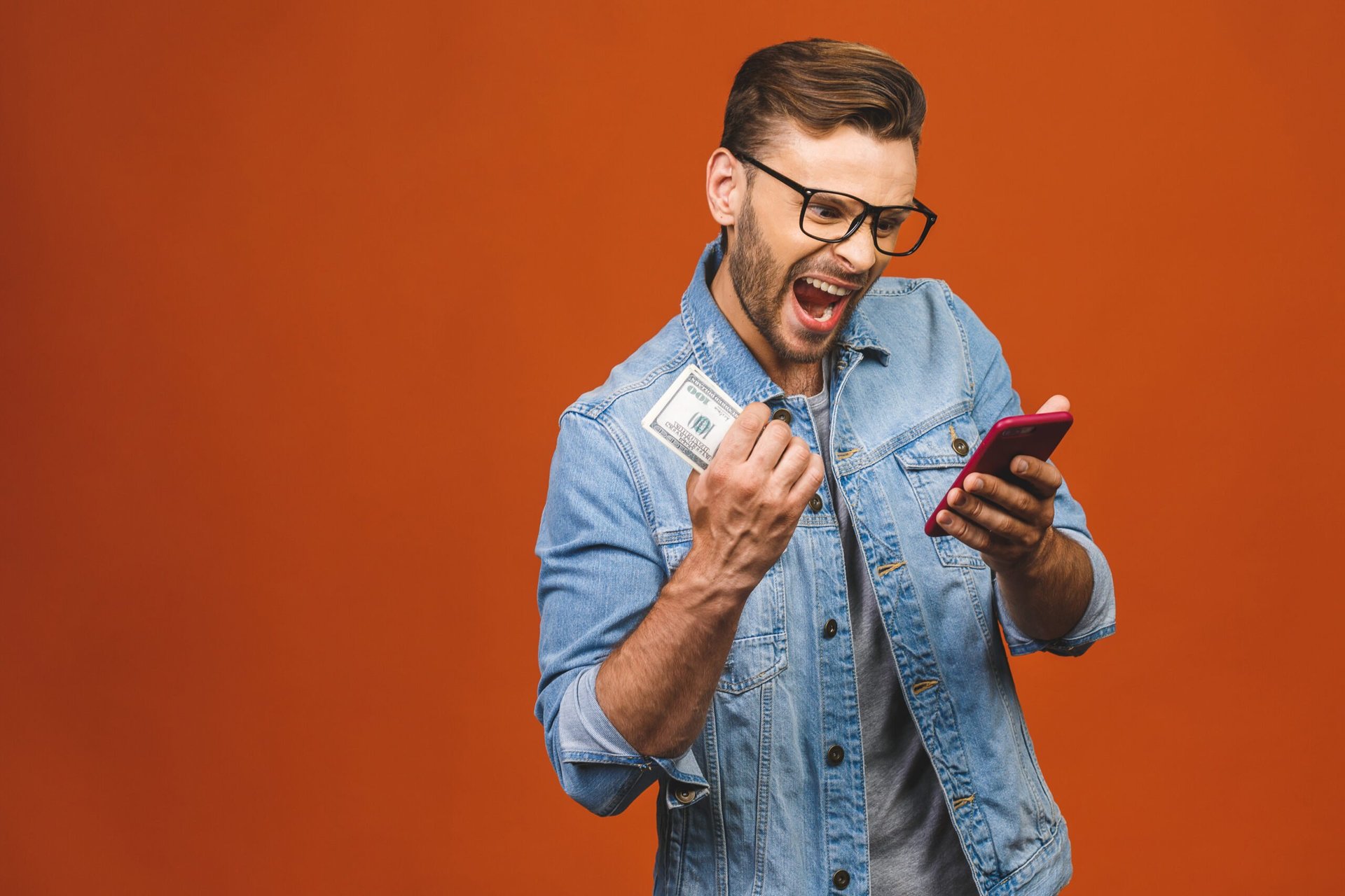 Man excited about savings on his cell phone smartphone plan