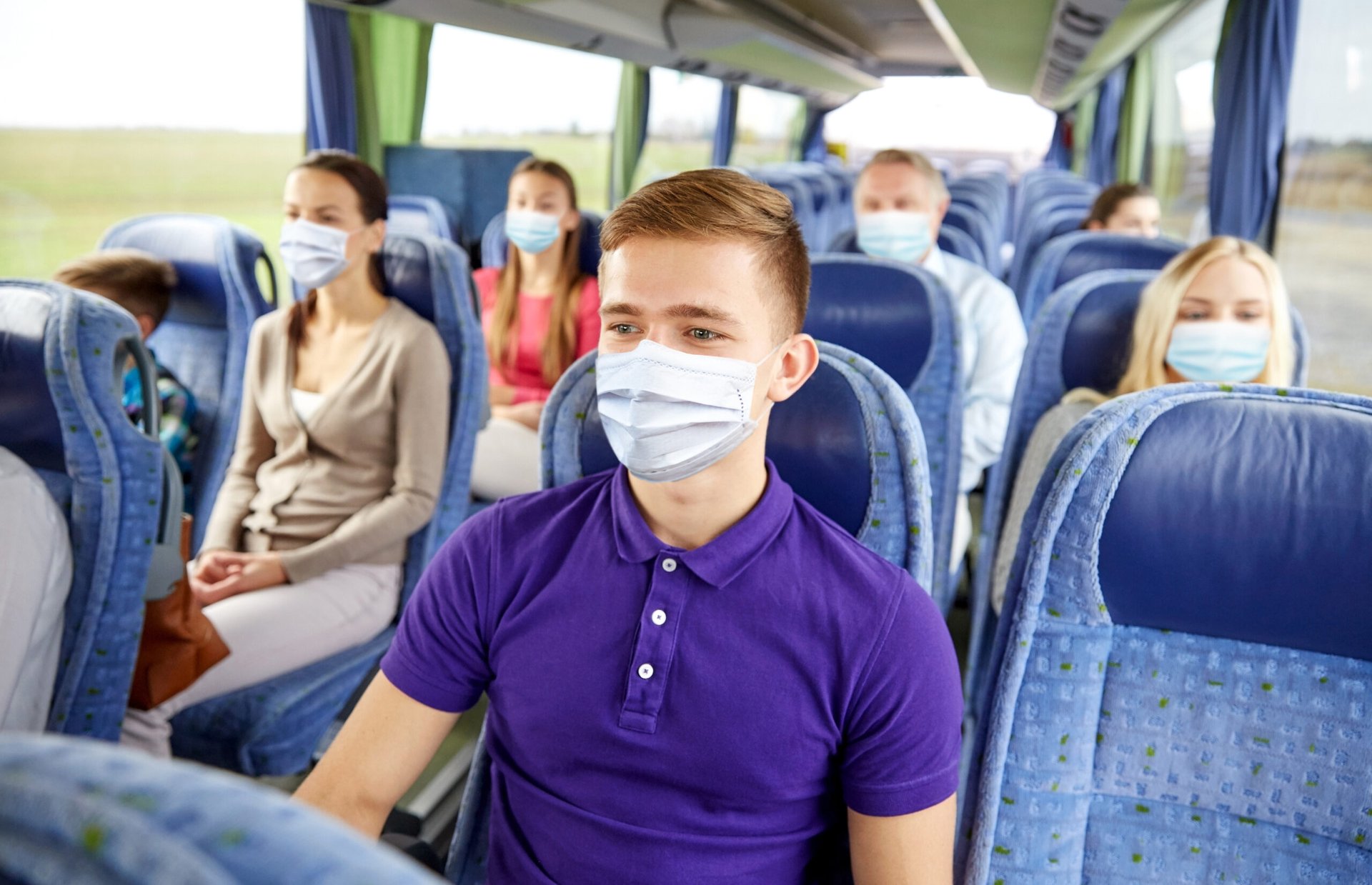 Teen wearing a mask on the bus