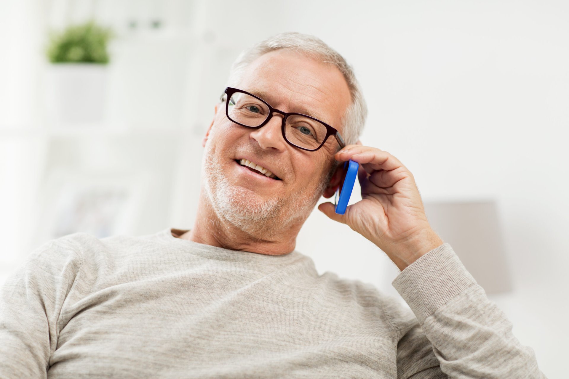 Senior man on the phone enjoying his smartphone plan