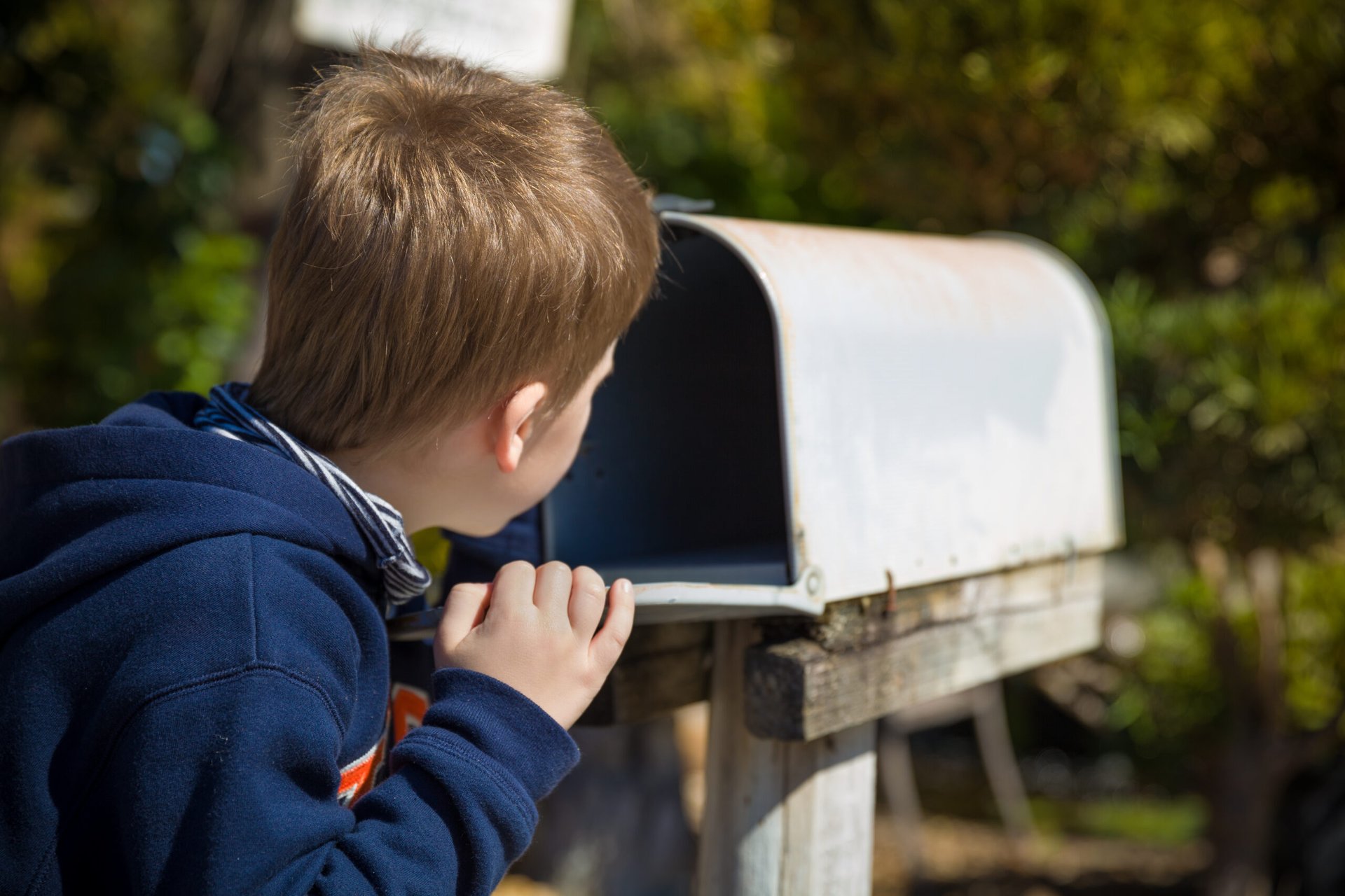 Boy waiting for mail to arrive