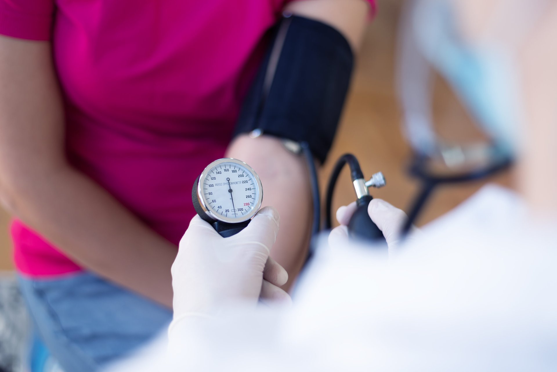 Doctor checking a patient's blood pressure