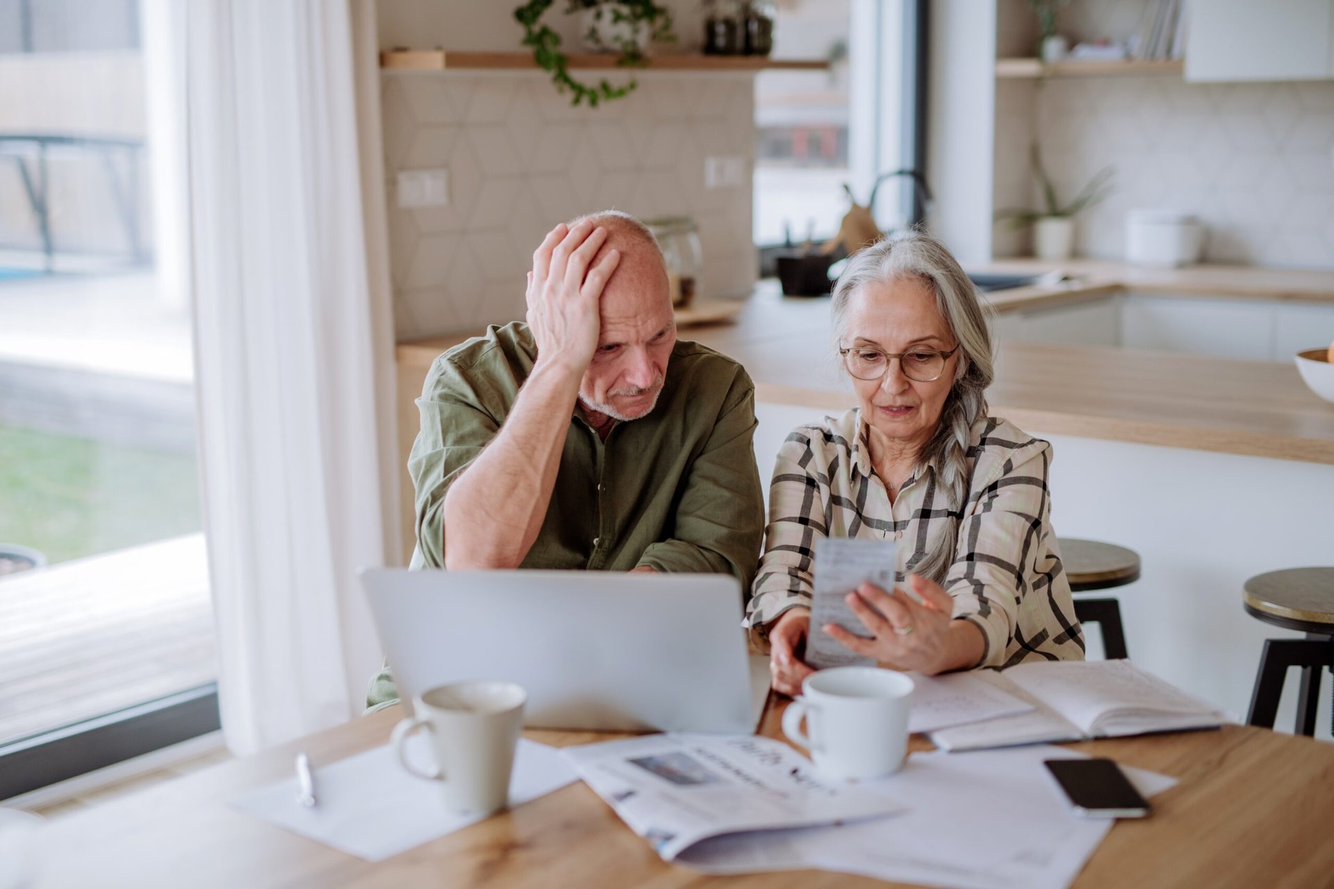 Worried seniors with tax documents