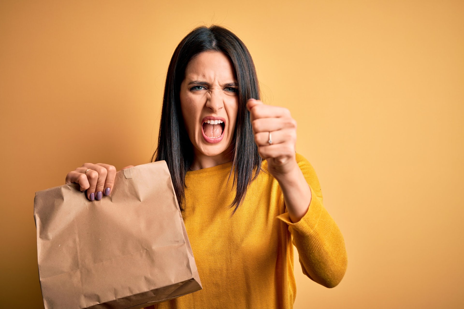 Unhappy woman with food delivery