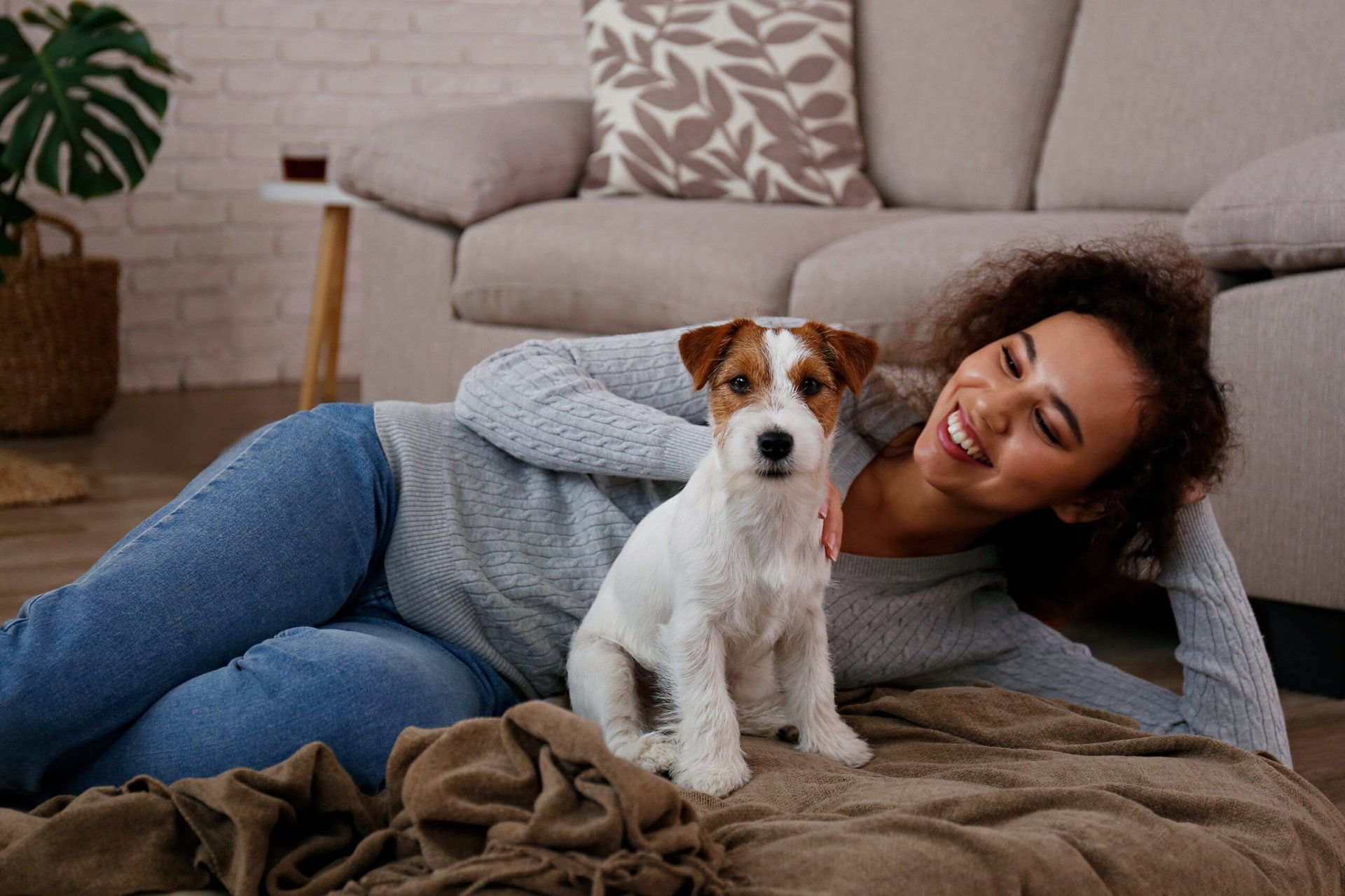 Woman relaxing with a dog in her living room