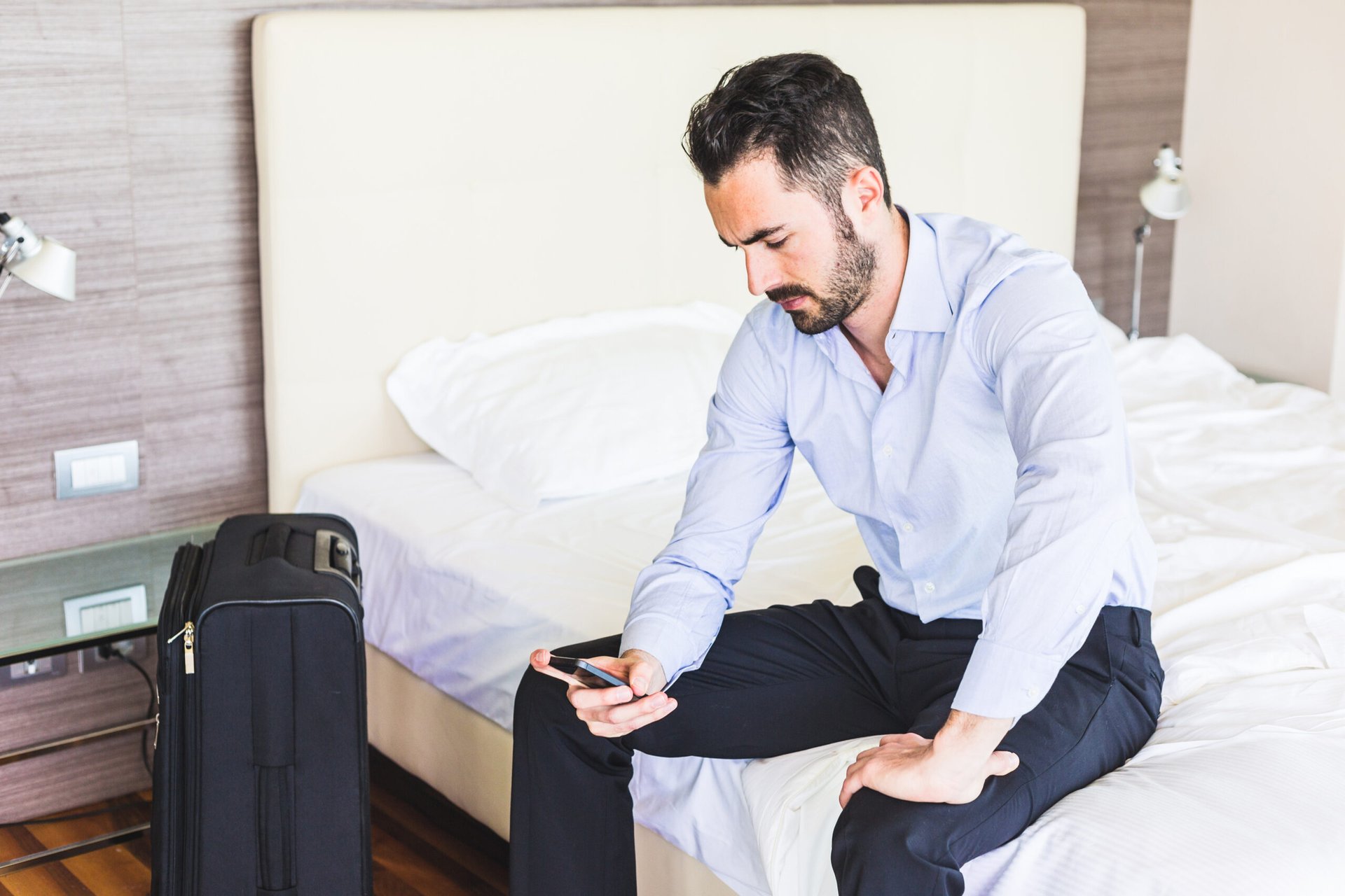 Man looking at hotel charges