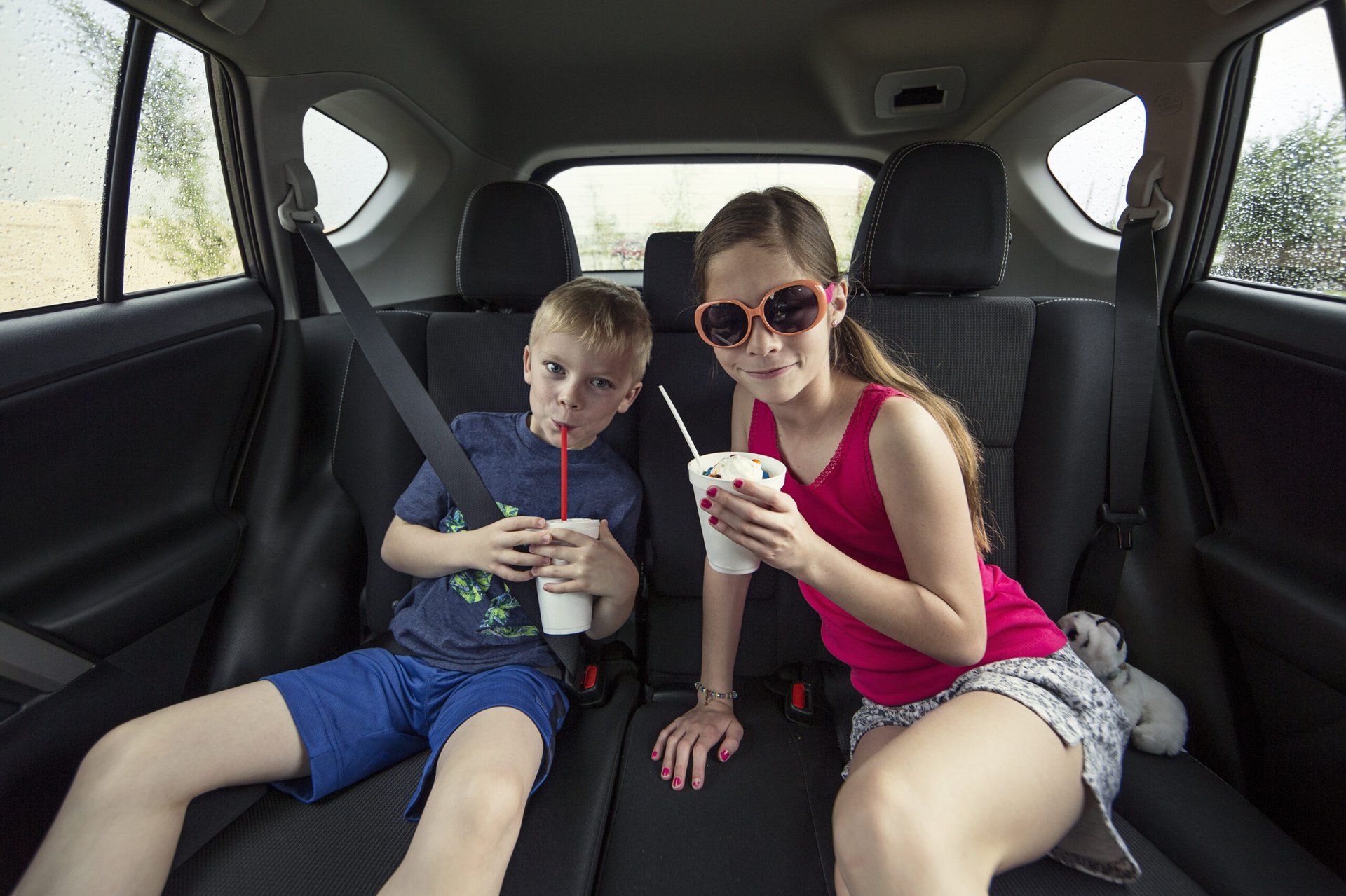 Kids eating food from the drive-thru