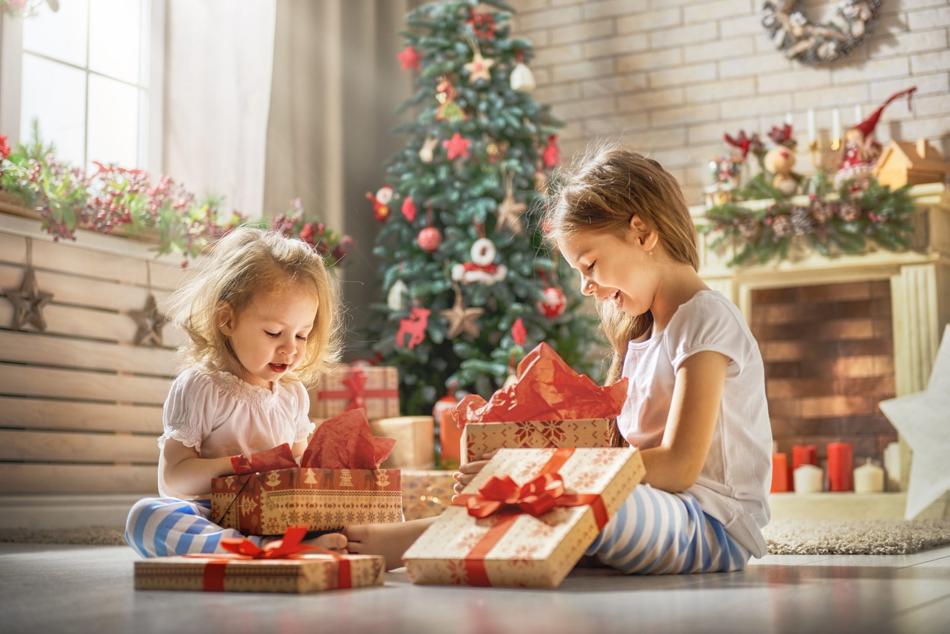 Children opening presents at Christmas