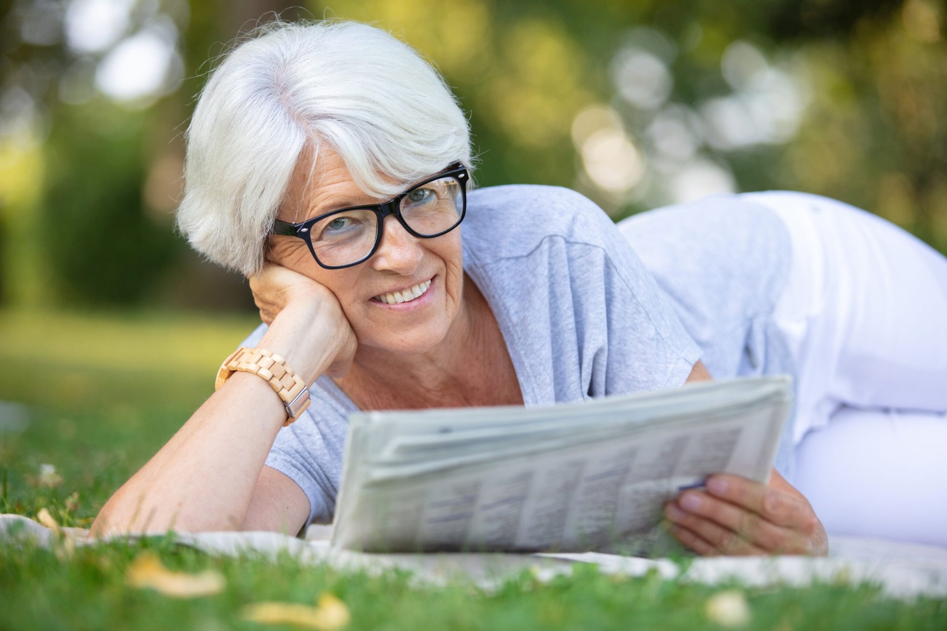 Happy retiree reading the newspaper