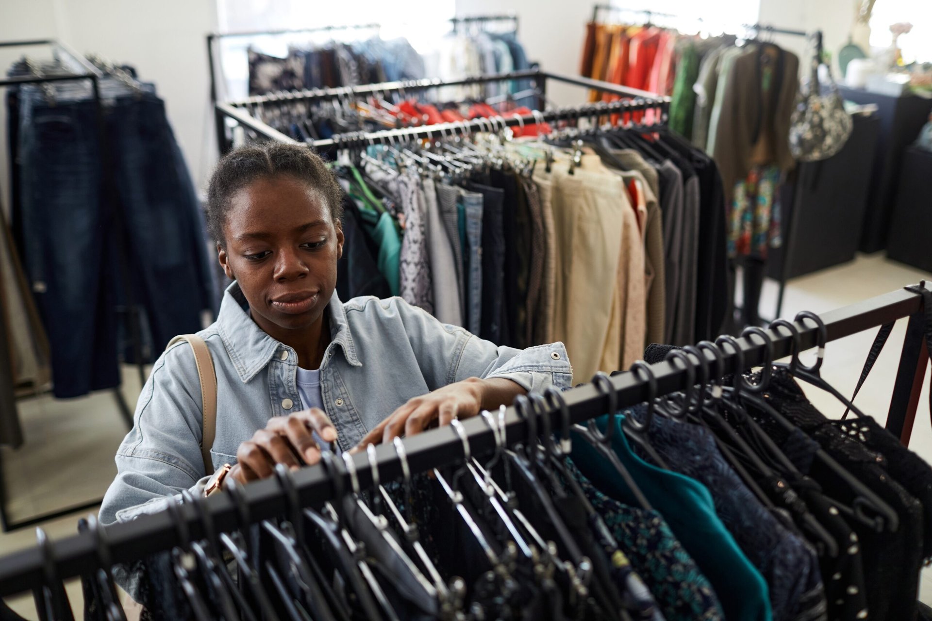 woman shopping at thrift store secondhand shop